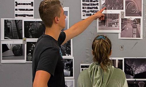 two students during a photography critique session